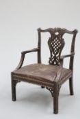 A MAHOGANY OPEN ARMCHAIR, IN THE IRISH CHIPPENDALE TASTE