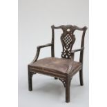 A MAHOGANY OPEN ARMCHAIR, IN THE IRISH CHIPPENDALE TASTE