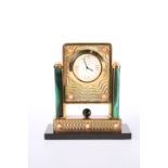 A MALACHITE AND CORAL-MOUNTED SILVER GILT TABLE CLOCK, IN THE FABERGE TASTE, PADGHAM & PUTLAND LTD,