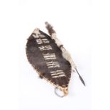 TRIBAL: A ZULU COW HIDE SHIELD AND STABBING SPEAR. (2)