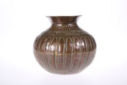 A MIDDLE EASTERN COPPER TUMBLER VASE