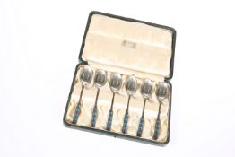 A SET OF SIX LIBERTY & CO SILVER AND ENAMEL SPOONS