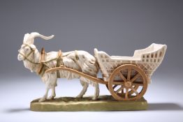 A ROYAL DUX MODEL OF A HARNESSED GOAT AND CART