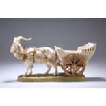 A ROYAL DUX MODEL OF A HARNESSED GOAT AND CART