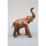 A VINTAGE LEATHER FIRESIDE MODEL OF AN ELEPHANT