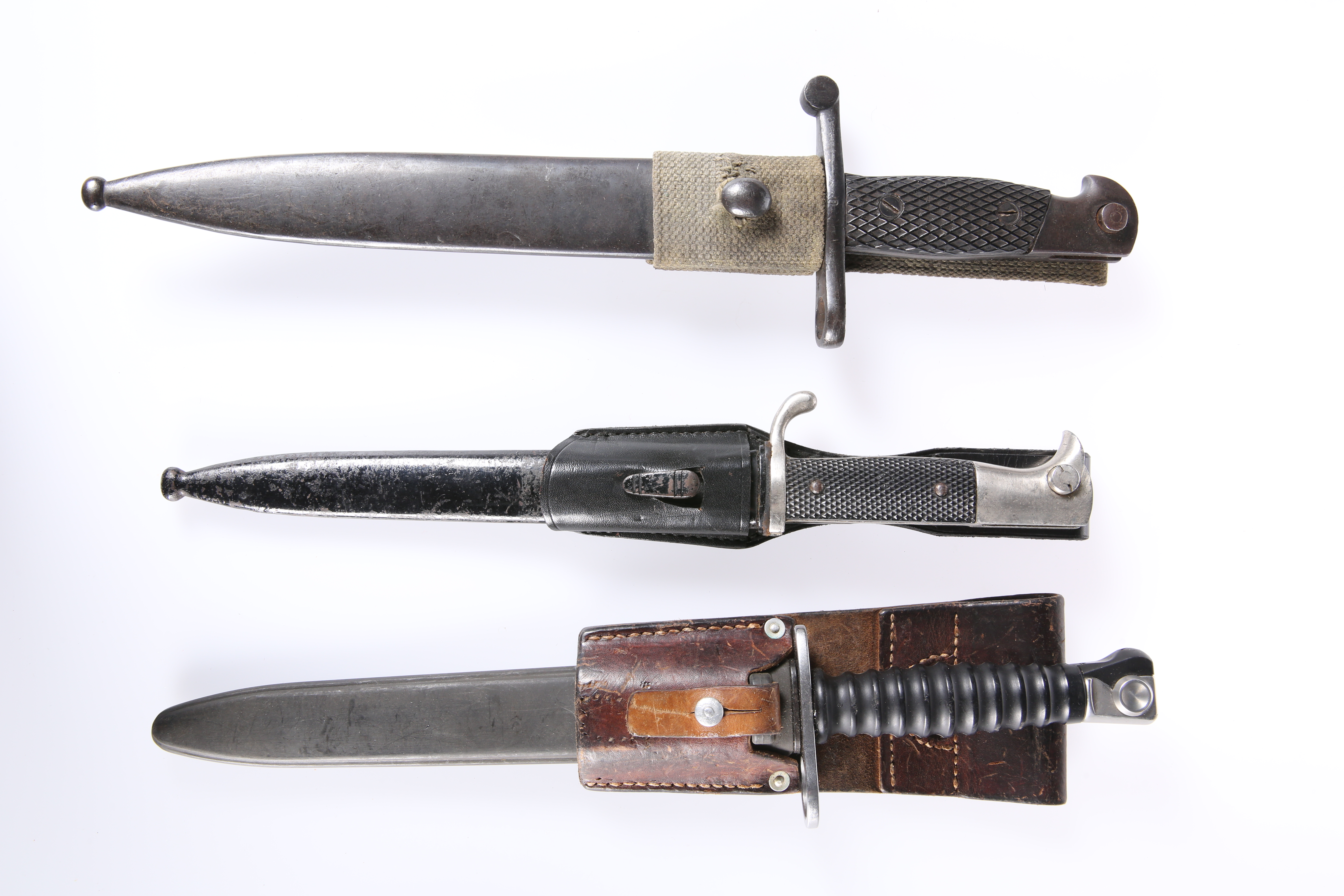THREE BAYONETS, including German WWII dress bayonet and a Swiss 1943 bayonet
