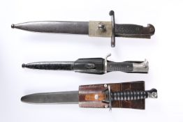 THREE BAYONETS, including German WWII dress bayonet and a Swiss 1943 bayonet