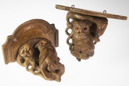 A PAIR OF 19TH CENTURY BLACK FOREST CARVED OAK WALL BRACKETS