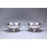 A MATCHED PAIR OF GEORGE III SILVER TWIN-HANDLED BOWLS OR BUTTER BOATS, LONDON 1782 AND 1793