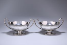 A MATCHED PAIR OF GEORGE III SILVER TWIN-HANDLED BOWLS OR BUTTER BOATS, LONDON 1782 AND 1793