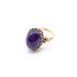 AN AMETHYST AND GOLD RING