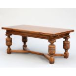 AN ELIZABETHAN STYLE OAK DRAW-LEAF DINING TABLE, CIRCA 1930