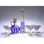 A 19TH CENTURY BOHEMIAN BLUE-OVERLAID AND GILDED CUT-GLASS LIQUEUR SET