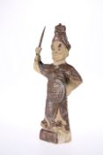 A CHINESE EARTHENWARE FIGURE