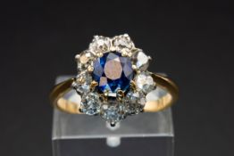 A SAPPHIRE AND DIAMOND CLUSTER RING