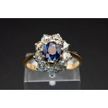 A SAPPHIRE AND DIAMOND CLUSTER RING