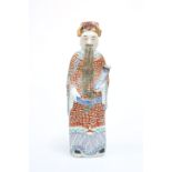 A CHINESE PORCELAIN FIGURE OF AN IMMORTAL