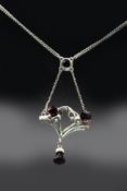 A SILVER AND AMETHYST PENDANT BY CHARLES HORNER