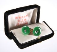 A PAIR OF CHINESE JADE AND DIAMOND CUFFLINKS, the round jade disc centred by a four-claw set