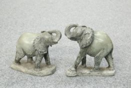 A PAIR OF CARVED STONE MODELS OF ELEPHANTS