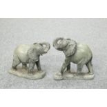 A PAIR OF CARVED STONE MODELS OF ELEPHANTS