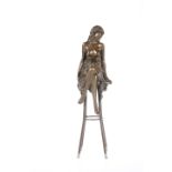 A BRONZE FIGURE OF A SEMI-NUDE MAIDEN, cast seated on a stool. 27cm