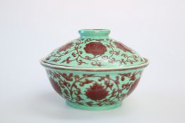 A CHINESE PORCELAIN COVERED BOWL, painted with scrolling foliage
