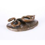AN UNUSUAL PATINATED METAL MODEL OF A SNAKE, CIRCA 1900
