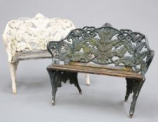 A PAIR OF FERN AND BLACKBERRY PATTERN CAST IRON GARDEN BENCHES