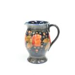 A WALTER MOORCROFT POTTERY POMEGRANATE PATTERN JUG