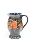 A WALTER MOORCROFT POTTERY POMEGRANATE PATTERN JUG