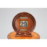 A LARGE EDWARDIAN OAK DESK CALENDAR