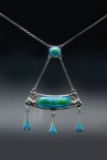 A SILVER AND ENAMEL PENDANT BY CHARLES HORNER