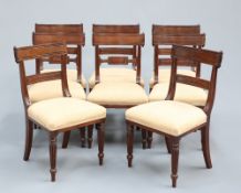 A HARLEQUIN SET OF EIGHT REGENCY MAHOGANY DINING CHAIRS