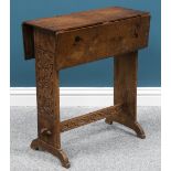 AN ARTS AND CRAFTS OAK DROPLEAF OCCASIONAL TABLE