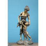 A PATINATED BRONZE FIGURE GROUP OF A MOTHER AND CHILDREN