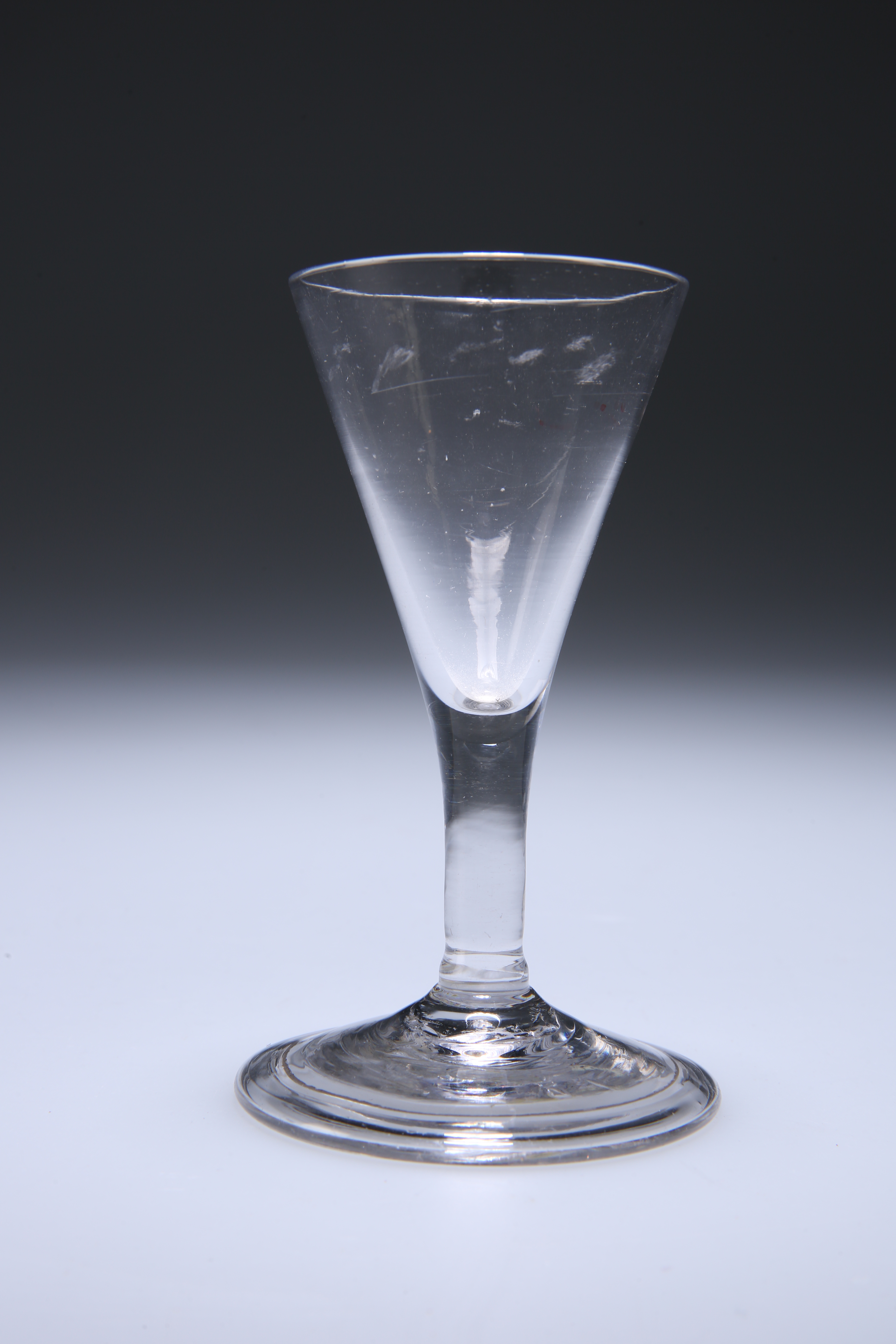 A RARE MINIATURE CORDIAL GLASS, CIRCA 1785, with folded foot. 11cm