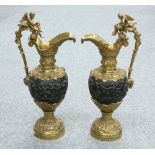 A LARGE PAIR OF RENAISSANCE REVIVAL GILT AND PATINATED BRONZE EWERS, 19TH CENTURY,
