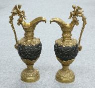 A LARGE PAIR OF RENAISSANCE REVIVAL GILT AND PATINATED BRONZE EWERS, 19TH CENTURY,