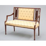 AN EDWARDIAN INLAID MAHOGANY SETTEE