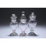 THREE ENGLISH GLASS CONDIMENT BOTTLES AND STOPPERS, CIRCA 1800