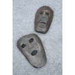 TRIBAL: TWO CARVED MASKS, each with pierced eyes and mouth