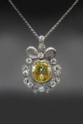 A CEYLON YELLOW SAPPHIRE AND DIAMOND PENDANT