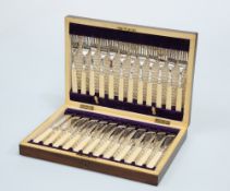 A SET OF TWELVE VICTORIAN SILVER-PLATED AND IVORY-HANDLED FISH KNIVES AND FORKS