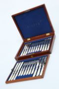A SET OF TWELVE VICTORIAN SILVER-PLATED AND MOTHER-OF-PEARL HANDLED DESSERT KNIVES AND FORKS
