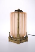 A STRIKING BRONZE AND MOULDED GLASS TABLE LAMP IN THE ART DECO TASTE,