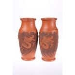 A PAIR OF JAPANESE TERRACOTTA VASES DECORATED WITH DRAGONS