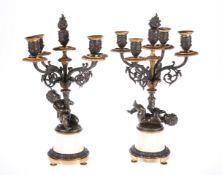 A PAIR OF 19TH CENTURY FRENCH PARCEL-GILT BRONZE AND ALABASTER FIGURAL CANDELABRA