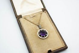 AN AMETHYST AND DIAMOND PENDANT