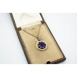 AN AMETHYST AND DIAMOND PENDANT